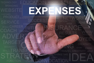 Businessman touching expenses button on virtual screen