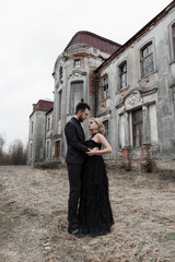 Fototapeta na wymiar Portrait of a young couple in black suit and dress. Wedding