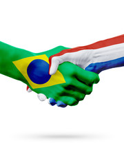 Flags Brazil, Netherlands countries, partnership friendship handshake concept.