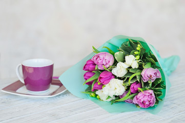 Spring still life with coffee and flowers bouquet, dating concept