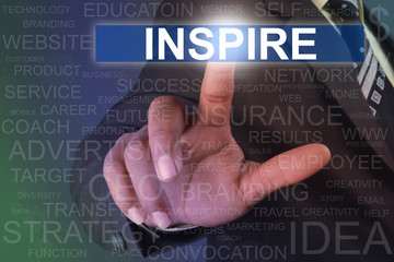 Businessman touching INSPIRE button on virtual screen