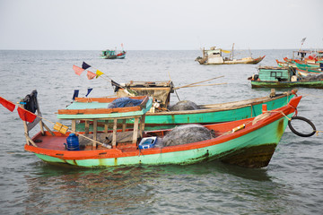 Naklejka na ściany i meble Colorful wooden fishing boat in Phu Quoc island sea, Kien Giang province, Vietnam