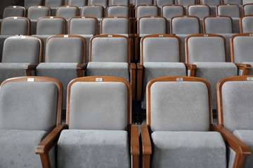 Fototapeta premium Rows of gray soft seats in empty cinema hall