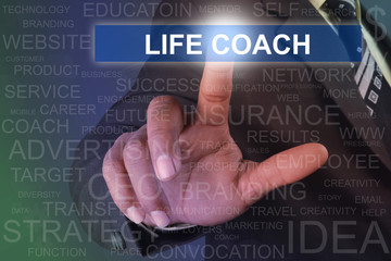 Businessman touching life coach button on virtual screen