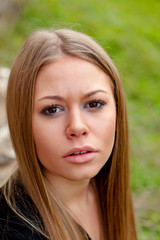 Fototapeta premium Beautiful blonde girl looking at camera