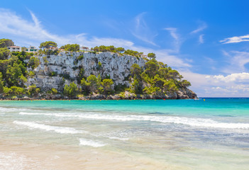 View on Mirador Sa Punta cliff from Cala Galdana beach at Menorca.