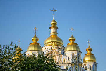 Fototapeta na wymiar Front of Mikhailovsky monastery in Kiev, Ukraine, with their typical golden domes.