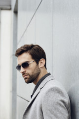 Obraz premium Sunglasses guy in grey overcoat