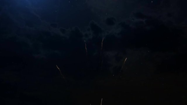 A set of slow motion fireworks on black background, isolated sequence animation without cropping, collage of colorful fireworks exploding in the night sky.