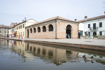 Fototapeta premium Comacchio, Ferrara, Italy: houses reflected in the canal