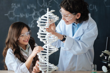 Curious children studying microbiology at school