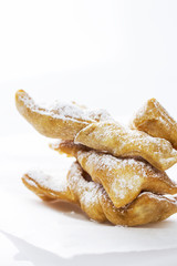 Traditional Angel Wings sprinkled with powdered  sugar, isolated