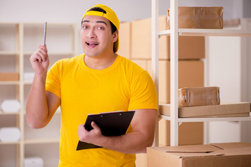 Man working in postal parcel delivery service office