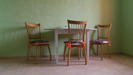 Fototapeta na wymiar Dining table and three chairs