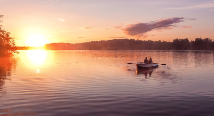 Romantic golden sunset river lake fog loving couple small rowing boat date beautiful Lovers ride...