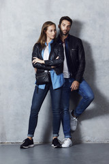 Gorgeous couple in leather jacket and jeans, portrait