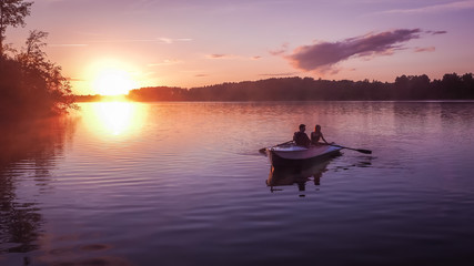 Romantic golden sunset river lake fog loving couple small rowing boat  date beautiful Lovers ride  during   Happy  woman man together relaxing water nature around