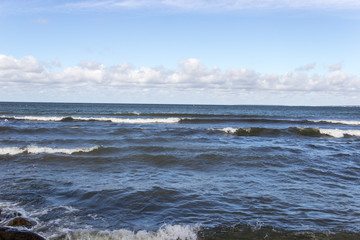 Fototapeta premium Sea, waves, lambs on the waves, clouds, summer, blue