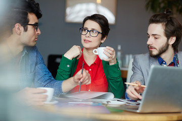 Young creative designers organizing their work or having short break