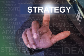 Businessman touching strategy button on virtual screen