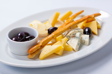 various types of cheese on a white plate