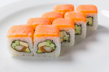 Rolls on the white plate. Japanese cuisine