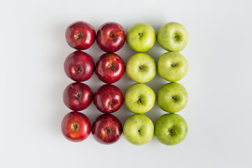 Top view of red and green apples in a row
