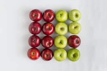 Top view of red and green juicy apples in a row