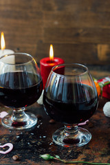 Romantic dinner drink - wine or brendy in glass.