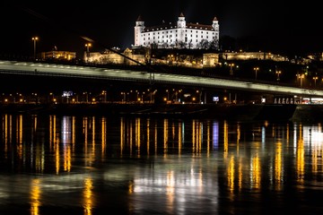 Bratislava, Slovakia - March 19, 2017: Night city reflection view. Bratislava castle at night 