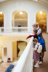 Fototapeta premium Schoolgirls and their teacher spending leisure in museum