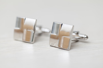 cufflinks on white background