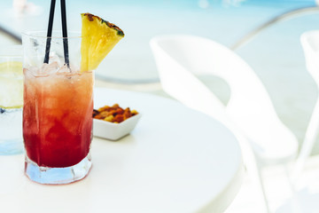 Fresh Red And Orange Cocktail Glass In Summer With Ocean Background