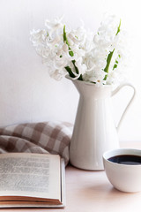 a bouquet of flowers in a vase on the table