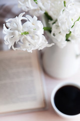 a bouquet of flowers in a vase on the table
