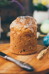 Traditional easter cake on wooden board over rustic table.