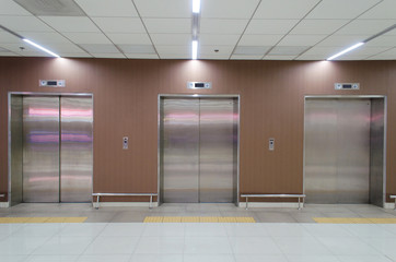  closed metal office building elevator doors in modern building © Vittaya_25