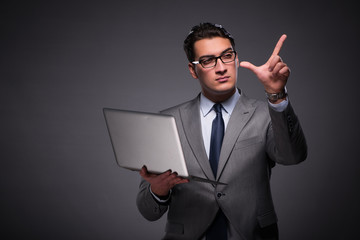 Handsome businessman working on laptop computer