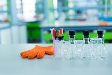 Beaker, flask, tube and glove for experiment chemical in Lab.