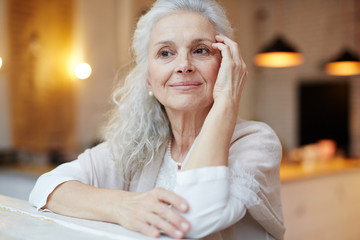 Serene woman relaxing in cafe at leisure