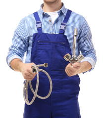 Plumber with flexible hose and tap on white background