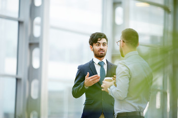 Businessman advising with colleague at break