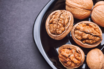 Walnuts in a black plate