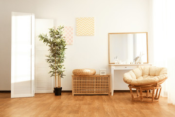 Light room interior with folding screen