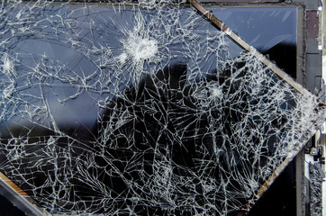 Broken computer tablet with shattered display