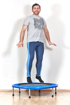 trampolin jumping at home caucasian male