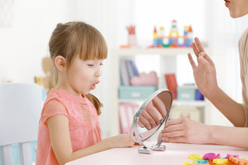 Cute little girl at speech therapist office