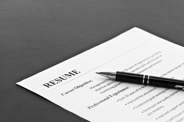 Closeup of Resume with Pen on the Table 