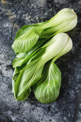 Overhead shot of Chinese cabbage, Bok Choy, on rustic background