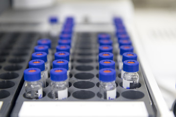 vials are arranged in the auto-sampler for the lab equipment.